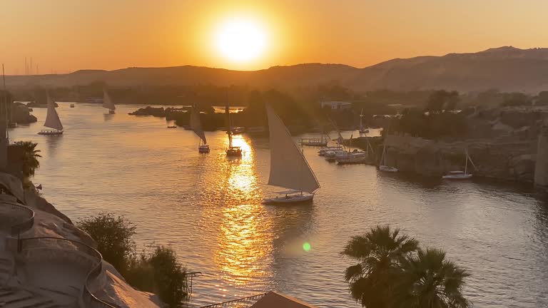 Beautiful landscape with felucca boats on the Nile river in Aswan, Egypt