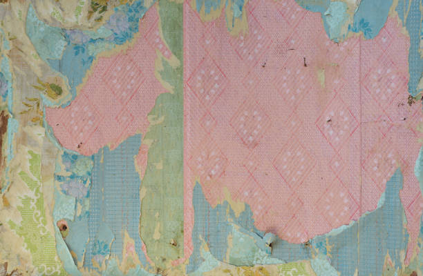 istock Old wallpaper on the wall. Old torn wallpaper for texture or background. 1499028872