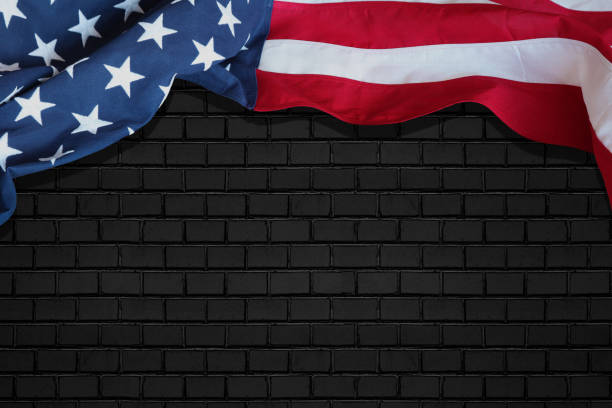 American flag on abstract black background with plenty of room for text. Memorial Day, Independence Day, Veterans Day, Labor Day. stock photo