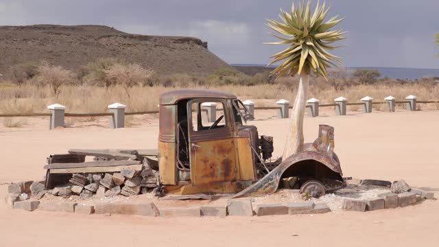 Abandoned and rusting car near the tiny oasis settlement of Solitaire, Namibia