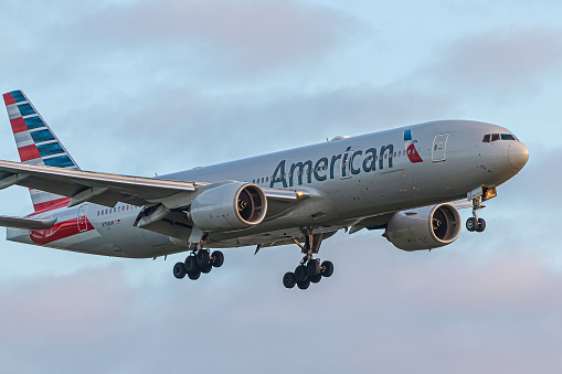 London, UK - May 29, 2023: Boeing 777 American Airlines approaching early morning to London Heathrow Airport.