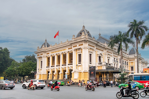 Hanoi, Vietnam-April 2023; View of Hanoi Opera House or Grand Opera House on Square of August Revolution busy with traffic in Neoclassicism style erected by French colonial administration