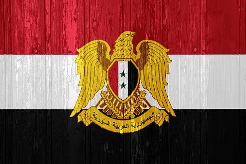 Flag of Syrian Arab Republic on a textured background. Concept collage.