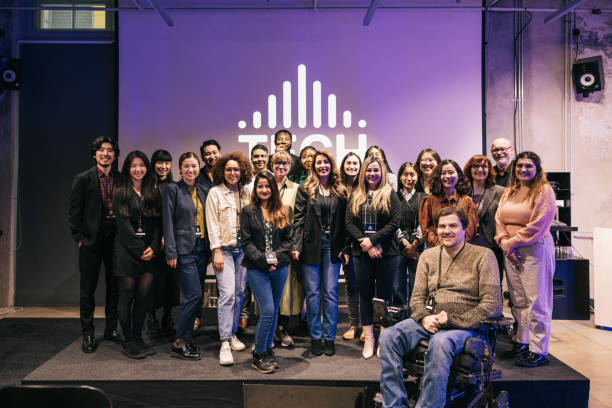 A diverse group photo with business tech attendees.