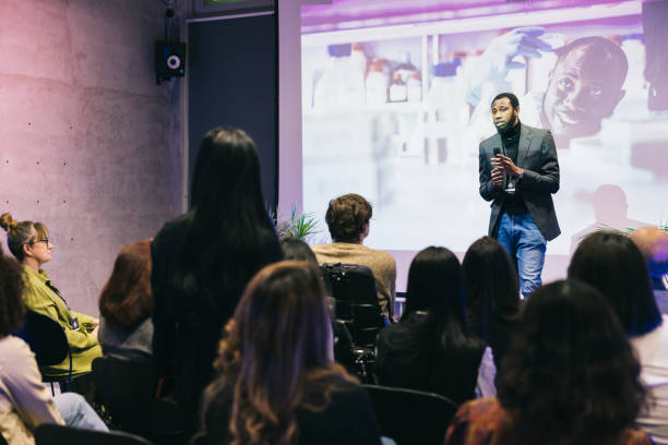 istock Entrepreneur giving a presentation for a diverse audience at conference 1499038734