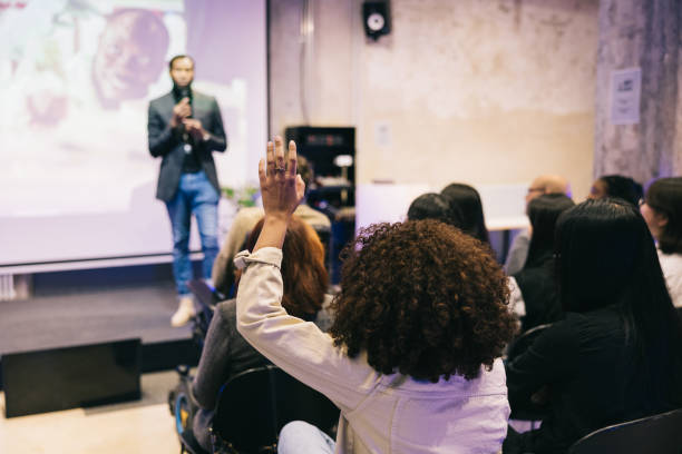 istock Entrepreneur giving a presentation for a diverse audience at conference 1499038736