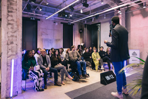 istock Entrepreneur giving a presentation for a diverse audience at conference 1499038763