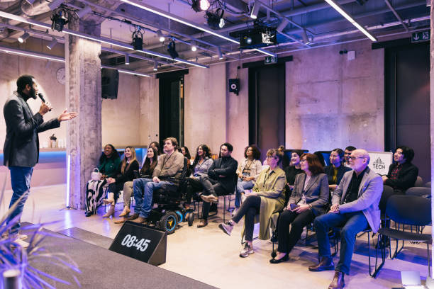 istock Entrepreneur giving a presentation for a diverse audience at conference 1499038775