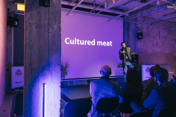 istock Entrepreneur talking about new product at Bio-tech conference 1499038785