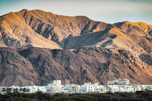 Residential district and mountain in Muscat, Oman.