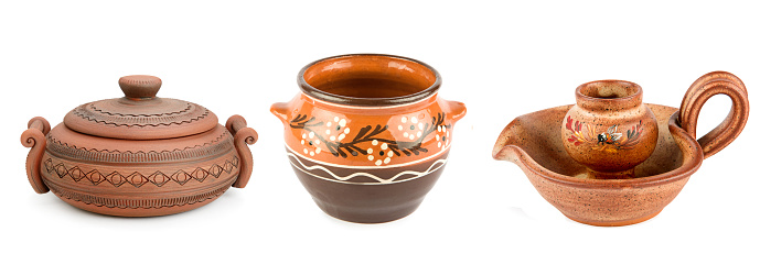 Set of clay pots and ceramic candle holder isolated on white background. Wide photo. Collage.