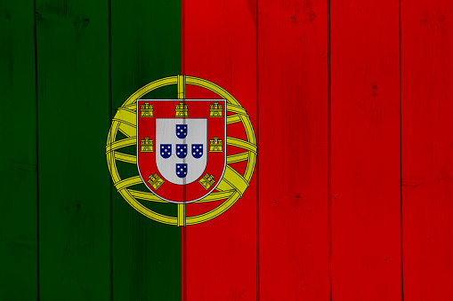 Flag of Portuguese Republic on a textured background. Concept collage.