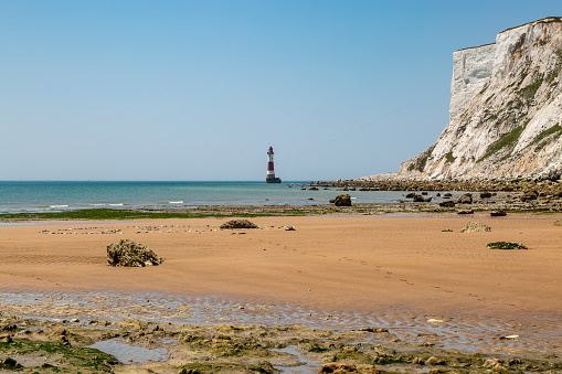 Low tide revealing a sandy beach, near Beachy Head Lighthouse off the Sussex coast