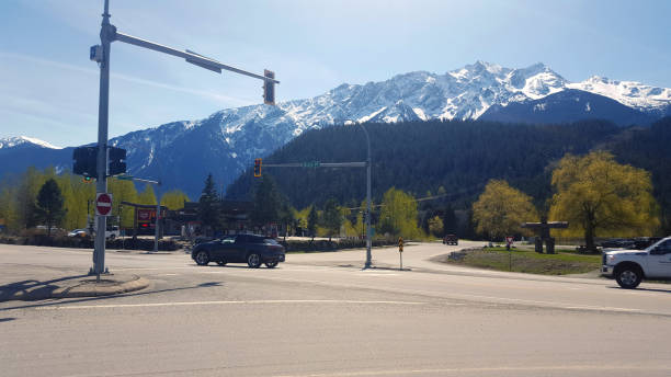 Route 99 Pemberton And Mt Currie British Columbia Pemberton, British Columbia, Canada - April 27,2023: Major traffic lights in Pemberton British Columbia. Mt Currie in background. pemberton town stock pictures, royalty-free photos & images