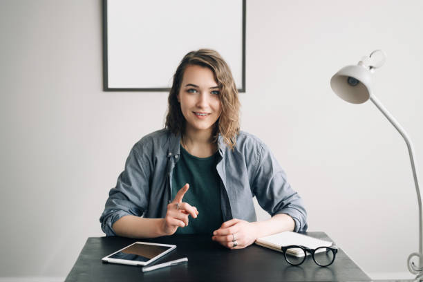 young-businesswoman-conducting-a-video-conference-from-office-or-home-engaged-and-confident.jpg?s=612x612&w=0&k=20&c=hz1vG4Mkd60909ZOx8fFpumWmLVLCwN8I_0rY3l_Mk8=