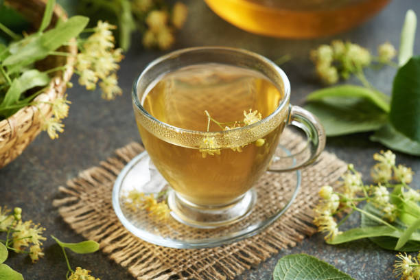 istock A cup of herbal tea with fresh linden flowers on a table 1499049924