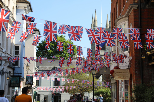 Londoners still enjoying the Coronation celebration decorations.