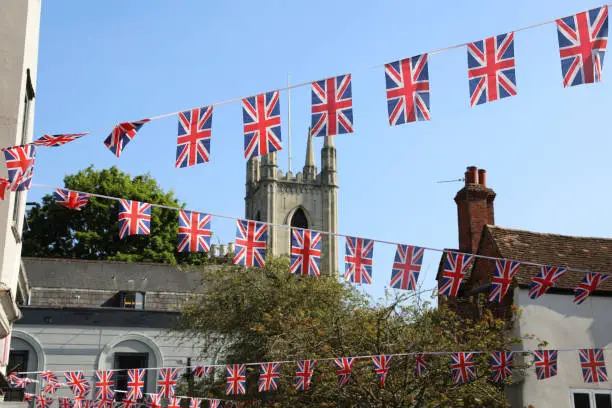 Londoners still enjoying the Coronation celebration decorations.