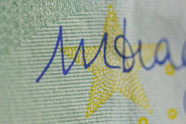 Protective watermark on a hundred euro bill in macro. protection against counterfeiting of banknotes. hologram. detail of paper money close up.