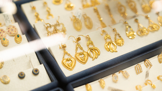 Heart shaped earrings stand in jewelery showroom
