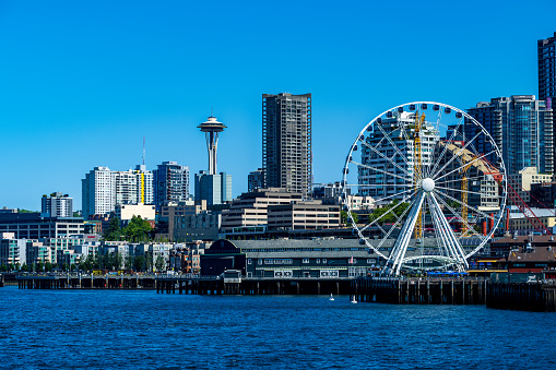 The Great Wheel on the Seattle waterfront with the Space Needle in the far distance