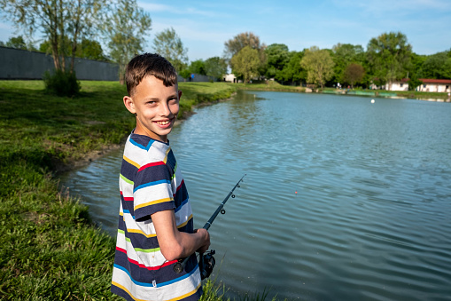 The boy enjoys fishing.