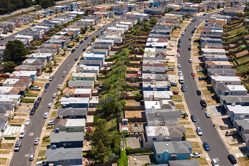 Aerial view of residential streets in Daly City, a suburb of San Francisco, on a sunny summer day.