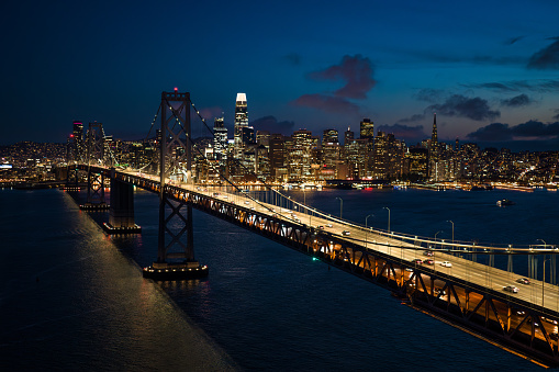 An aerial shot of the San Francisco skyline taken by a drone at night.
