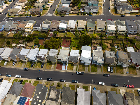 Aerial view of residential streets in Daly City, a suburb of San Francisco, on a sunny summer day.