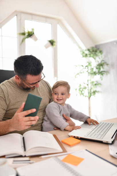 istock Selfie With Smartphone At Work By Father And Baby Son 1499060215