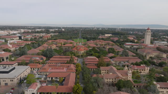 Aerial view of large campus of Leland Stanford Junior University. Forwards fly above complex of buildings . Stanford, California, USA
