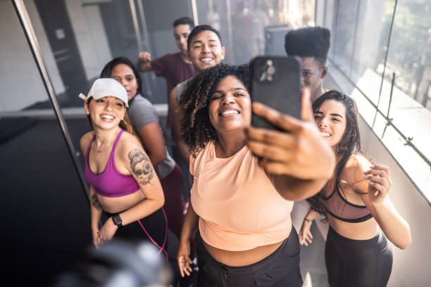 istock Young woman taking selfies on the mobile phone in a dancing class at a dance studio 1499069428