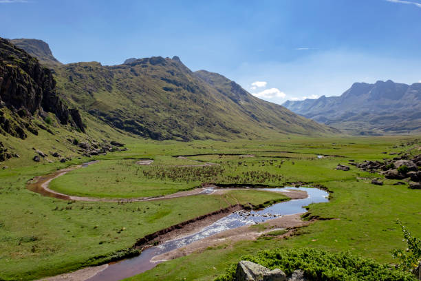 istock Green meadows with river meanders in Aguas Tuertas valley, 1499083849