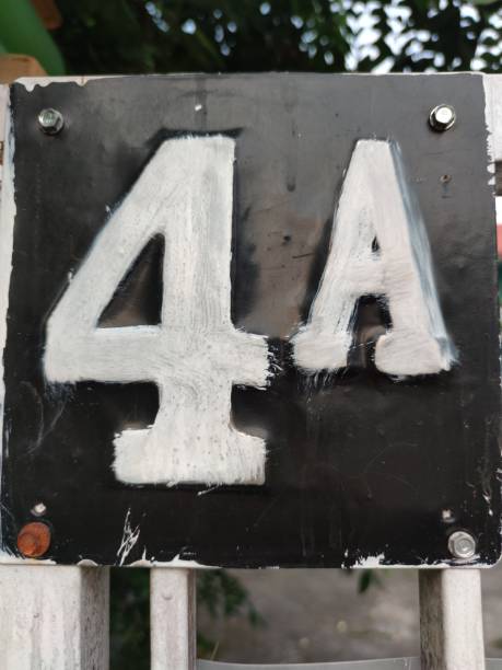 istock the house number hanging on the fence 1499086830
