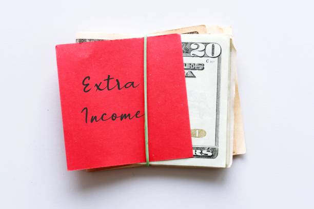istock Dollars cash money , red paper note with text written SIDE HUSTLE on white background - concept of financial planning - make more extra earnings from part time side hustle , second job or side gig to boost total income 1499091127