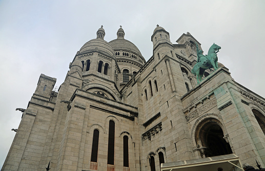 Exterior of famous 19th century Sacre-Coeur Basilica on Montmartre Hill in Paris, France