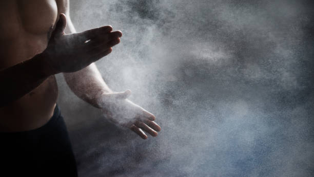 istock Magnesium, chalk and bodybuilder hands preparing for a workout or weight training at the gym. Fitness, talc and male athlete getting ready for bodybuilding exercise in sports center with mockup space 1499112813