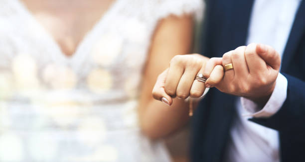 istock Hands, groom and bride with wedding rings in pinky promise for commitment, swear or vow on mockup. Hand of married couple in love, partnership or trust for marriage bond, loyalty or agreement 1499114099