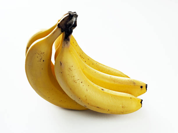 istock Closeup of bananas on white background 1499115318