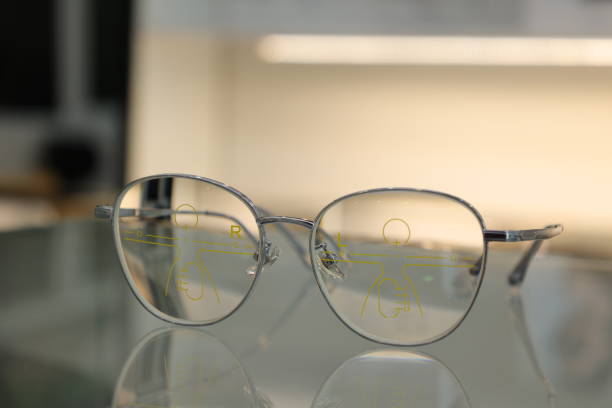 istock Eyeglasses on table, progressive lenses, eyeglasses for the elderly, glasses progressive lens, eyeglass progressive lens, close-up of glasses on blur background, looking through glasses 1499116982
