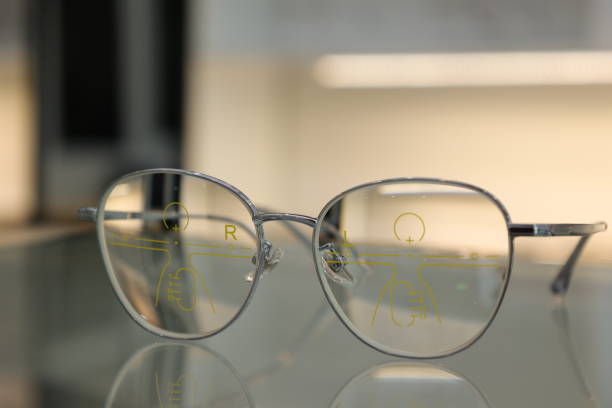 istock Eyeglasses on table, progressive lenses, eyeglasses for the elderly, glasses progressive lens, eyeglass progressive lens, close-up of glasses on blur background, looking through glasses 1499117053