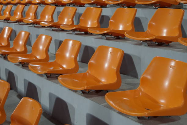 Tribune seats refer to the raised seating areas, often tiered and covered, in stadiums or other venues, from which spectators can watch an event.