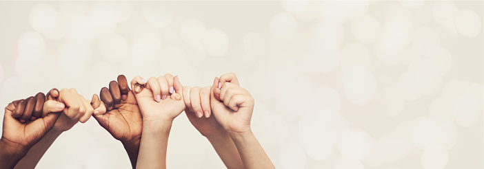 Hands, friends and holding hands with diversity and trust, pinky promise and mockup space on studio background. Team, support and solidarity with bokeh overlay, winning and people with connection