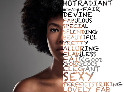 Black woman, afro and portrait with words, text or collage for empowerment or message isolated on background. African American female with letters overlay on face in reminder for beauty or self worth