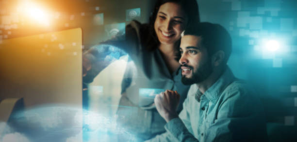 istock Creative business people, digital marketing and social networking for future development at night in double exposure. Happy developers smiling for cybersecurity big data, innovation or online startup 1499124939