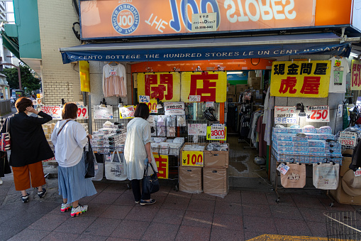 Tokyo, Japan - May 24, 2023 : Customers browse protective face masks at a store in Tokyo, Japan.