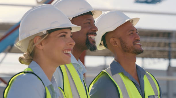 Civil engineering, diversity and group of people at construction with smile, leadership and cooperation. Happiness, men and woman in or contractor team working together on building project