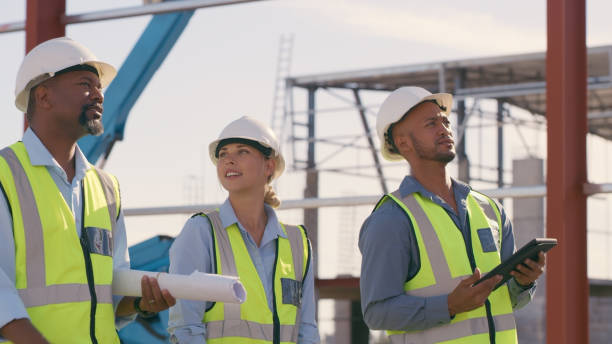 istock Talking, construction worker and tablet outdoor for planning building, architecture and vision. Engineer team or people on app for collaboration and innovation for engineering development 1499135872