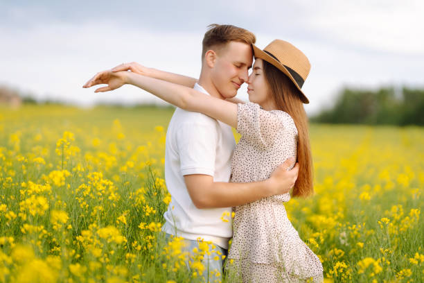 istock Young Couple in the blooming field 1499137557