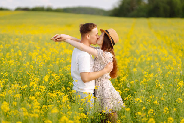 istock Young Couple in the blooming field 1499137560